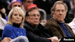 FILE - Los Angeles Clippers owner Donald Sterling (C), his wife Shelly (L) and actor George Segal attend the NBA basketball game between the Toronto Raptors and the Los Angeles Clippers at the Staples Center in Los Angeles.