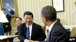 President Barack Obama meets with Chinese Vice President Xi Jinping, Tuesday, Feb., 14, 2012, in the Oval Office of the White House in Washington. (AP Photo/Susan Walsh)