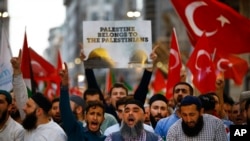 Protesters, some holding Turkish flags, chant slogans during a demonstration in Istanbul against the move of the U.S. embassy from Tel Aviv to Jerusalem, May 14, 2018. 