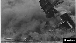 FILE - A view of the USS Arizona burning after the Japanese attack on Pearl Harbor in Hawaii, Dec. 7, 1941. 