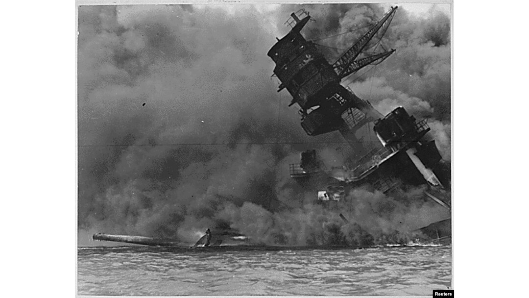 FILE - A view of the USS ARIZONA burning after the Japanese attack on Pearl Harbor in Hawaii Dec. 7, 1941.
