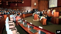 Empty seats, right side, which is believed to be sited by opposition of Cambodia National Rescue Party's parliamentary as Prime Minister Hun Sen, rear center, sits in the session hall of National Assembly with party lawmakers of the Cambodian People Party, Phnom Penh, Cambodia, file photo. 