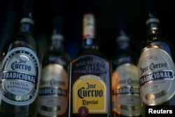 Bottles of Jose Cuervo Tequila rest on a shelf in Mexico City, Mexico, Feb. 8, 2017.