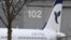 FILE - An Airbus with the description "The Airline of the Islamic Republic of Iran" is parked at the Airbus facility in Hamburg Finkenwerder, Dec. 19, 2016. Iran 's aviation body announced Sunday the cancelation of flights at some of the country's airports. 