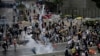 Riot police fire tear gas to protesters outside the Legislative Council in Hong Kong, June 12, 2019. 