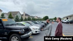 Alex Tovstanovsky (Left), owner of used-car dealer Prestige Motor Works,with his general manager Ryan Caton in Naperville, Il. Taken May 28, 2020