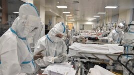 Nurses attend Covid-19 patients at the intensive care unit of a hospital in Athens on November 20, 2020.