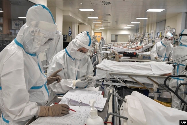 Nurses attend Covid-19 patients at the intensive care unit of a hospital in Athens on November 20, 2020.