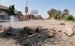 Pro-democracy protesters blocked roads with makeshift barricades and fires a day after the military seized power in a move widely denounced by the international community, in front of Mercy Care Hospital, in Khartoum, Sudan, Oct. 26, 2021.