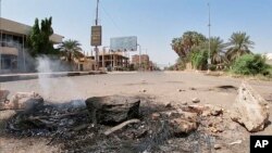 Pro-democracy protesters blocked roads with makeshift barricades and fires a day after the military seized power in a move widely denounced by the international community, in front of Mercy Care Hospital, in Khartoum, Sudan, Oct. 26, 2021. 