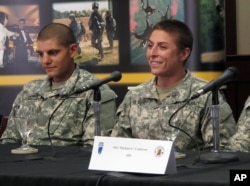 U.S. Army Army 1st Lt. Shaye Haver, right, speaks with reporters, Thursday, Aug. 20, 2015.