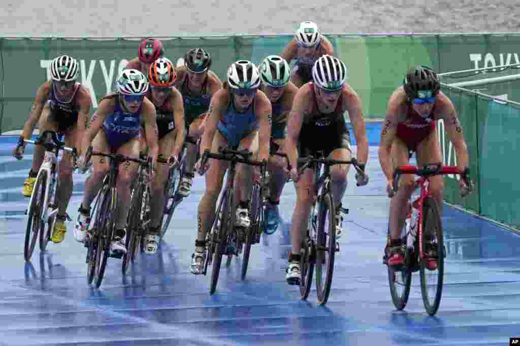 Simone Ackermann of South Africa (7) competes during the bike leg of the women&#39;s individual triathlon competition at the 2020 Summer Olympics, Tuesday, July 27, 2021, in Tokyo, Japan. (AP Photo/Charlie Riedel)