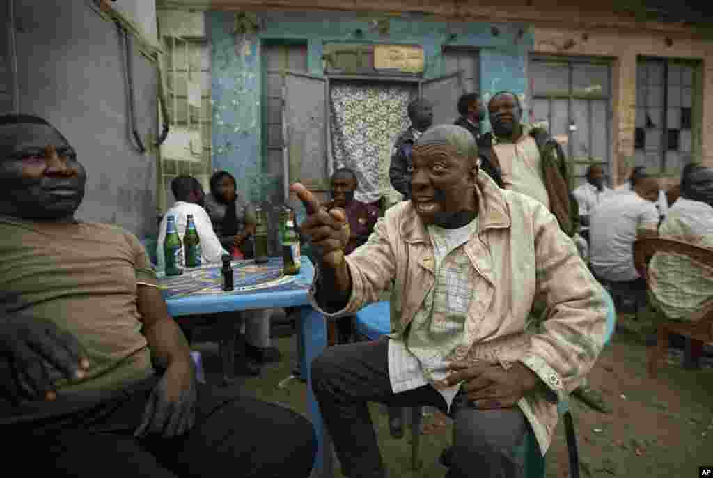 Nigerians&nbsp;in Kano, Nigeria have heated but friendly discussions about the delayed election, on February 16, 2019. (AP Photo/Ben Curtis)