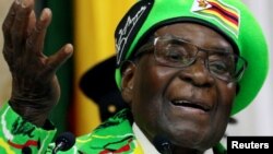 Zimbabwean President Robert Mugabe addresses a meeting of his ruling ZANU PF party's youth league in Harare, Zimbabwe, Oct. 7, 2017. 