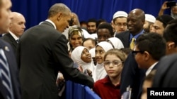 U.S. President Barack Obama greets students after his remarks at the Islamic Society of Baltimore mosque in Catonsville, Maryland, Feb. 3, 2016.