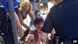 A person is treated by first responders after a deadly stabbing attack on University of Texas campus in Austin, Texas, May 1, 2017. 