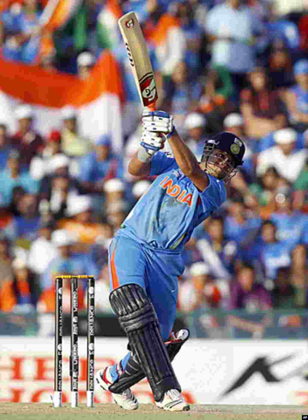 India's Suresh Raina plays a shot during their ICC Cricket World Cup 2011 semi-final match against Pakistan in Mohali, March 30, 2011.