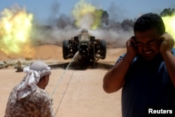 Libyan forces allied with the U.N.-backed government fire a 122 MM artillery towards Islamic State fighters positions in Sirte, Libya, July 24, 2016.