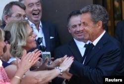 FILE - Nicolas Sarkozy, head of the Les Republicans political party and former French President, leaves his campaign headquarters in Paris, France, August 23, 2016.