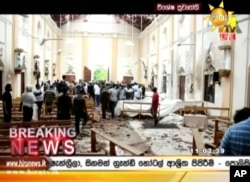 This image made from video provided by Hiru TV shows damage inside St. Anthony's Shrine after a blast in Colombo, April 21, 2019. Near simultaneous blasts rocked three churches and three hotels in Sri Lanka on Easter.