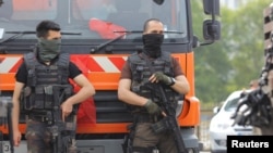 Members of the police special forces stand guard in front of the Air Force Academy in Istanbul, Turkey, July 18, 2016. 