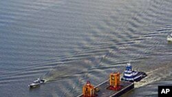 The Blow Out Preventer (BOP) from the Deepwater Horizon heads up the Mississippi River in route to a NASA facility in Michoud, 11 Sep 2010