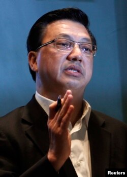Malaysian Transport Minister Liow Tiong Lai speaks at a press conference near Kuala Lumpur International Airport in Sepang July 18, 2014.