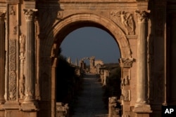 FILE - View of the arch of Septimus Severus in the ruins of the old Roman town of Leptis Magna near Khoms, Libya, July 18, 2012.