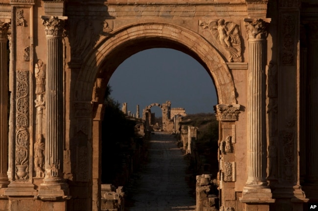 FILE - View of the arch of Septimus Severus in the ruins of the old Roman town of Leptis Magna near Khoms, Libya, July 18, 2012.