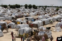 FILE - This view shows one of the biggest camps for people displaced by Islamist extremists in Maiduguri, Nigeria, Aug. 28, 2016.
