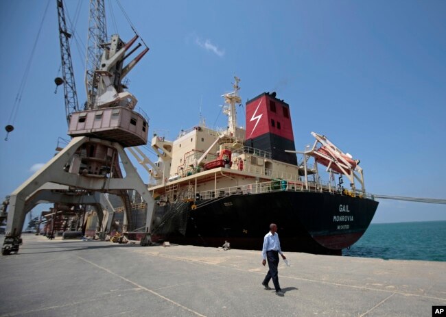 FILE - A cargo ship is docked at the Red Sea port city, of Hodeida, Yemen, Sept. 29, 2018.