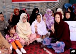 FILE - Pakistani lawyer Jalila Haider, center, from the Hazara Shiite minority community participates in a hunger strike with others at a camp in Quetta, April 30, 2018.