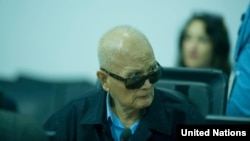 Nuon Chea listens to closing arguments at the Khmer Rouge tribunals, Oct. 16, 2013.