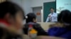 In this Tuesday, Dec. 1, 2009 photo, economist Ilham Tohti speaks to students at the Central Nationalities University in Beijing, China.