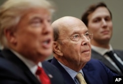 Commerce Secretary Wilbur Ross, center, listens to President Donald Trump during a meeting with House and Senate legislators in the Roosevelt Room of the White House, Feb. 2, 2017.