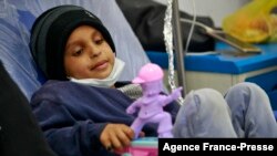 FILE - A child suffering from blood cancer (Leukemia) receives treatment at an oncology ward of a hospital in the Yemeni capital Sanaa, on World Cancer Day, on Feb. 4, 2021.