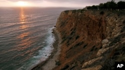 FILE - The sun sets down at the Point Vicente Park on the Pacific Ocean in Palos Verdes, Calif. U.S. Enviromental Protection Agency rank the ocean among the most hazardous places in the country.