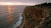 FILE - The sun sets down at the Point Vicente Park on the Pacific Ocean in Palos Verdes, Calif. U.S. Enviromental Protection Agency rank the ocean among the most hazardous places in the country.