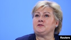 FILE - Norway’s Prime Minister Erna Solberg attends a press conference after a meeting at the Chancellery in Berlin, Germany, June 29, 2017. Solberg will be in Washington this week to meet with President Donald Trump.