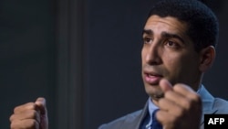 Retired US Army Captain Florent Groberg speaks to reporters at the Pentagon on October 29, 2015 in Washington, DC. 