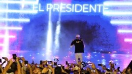 El Salvador's President Nayib Bukele participates in the closing ceremony of a congress for cryptocurrency investors in Santa Maria Mizata, El Salvador, Saturday, Nov. 20, 2021. (AP Photo/Salvador Melendez)