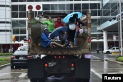 Evacuees are transported to the George R. Brown Convention Center after Hurricane Harvey inundated the Texas Gulf coast with rain causing widespread flooding, in Houston, Aug. 27, 2017.