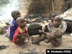 Children eating some food in Tchakarmari village, Cameroon, Apr, 20, 2019.