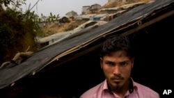 Rohingya Muslim refugee Mohammad Lalmia, 20, from the Myanmar village of Gu Dar Pyin, is pictured in Balukhali refugee camp, Bangladesh, Jan. 14, 2018. The Associated Press has confirmed more than five previously unreported mass graves in Gu Dar Pyin through multiple interviews with more than two dozen survivors in Bangladesh refugee camps and through time-stamped cellphone videos.