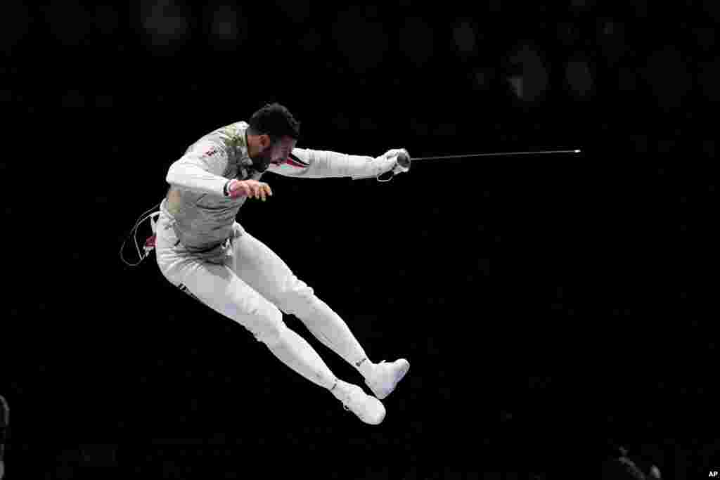 Alaaeldin Abouelkassem of Egypt celebrates after winning a men&#39;s individual round of 16 Foil competition at the 2020 Summer Olympics in Chiba, Japan.