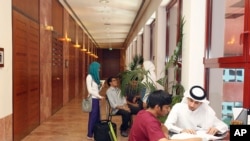 FILE - In this 2011 photo, students of different nationalities study at the Texas A&M University campus at Education City in Doha, Qatar.
