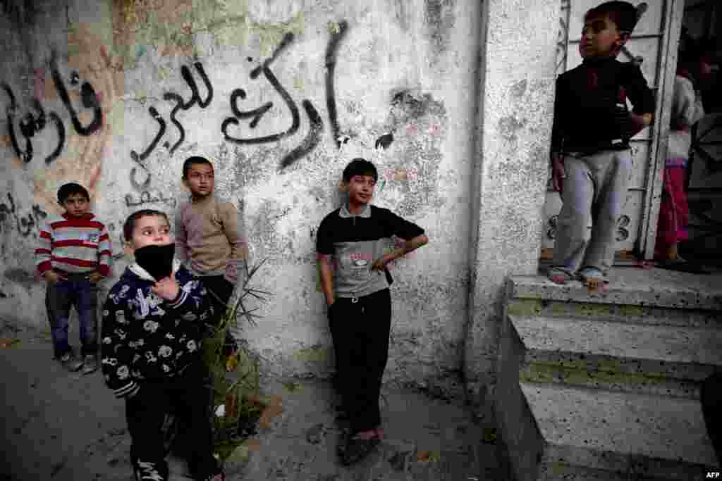 Young boys mourn during the funeral of Bilal Samir Oweida, a 20-year-old Palestinian, in Beit Lahia, northern Gaza Strip. Oweida was &quot;shot in the chest by Israeli soldiers&quot; east of Jabaliya according to a spokesman for the Hamas-run health ministry. Israeli forces said Oweida had entered &quot;a prohibited area&quot;.