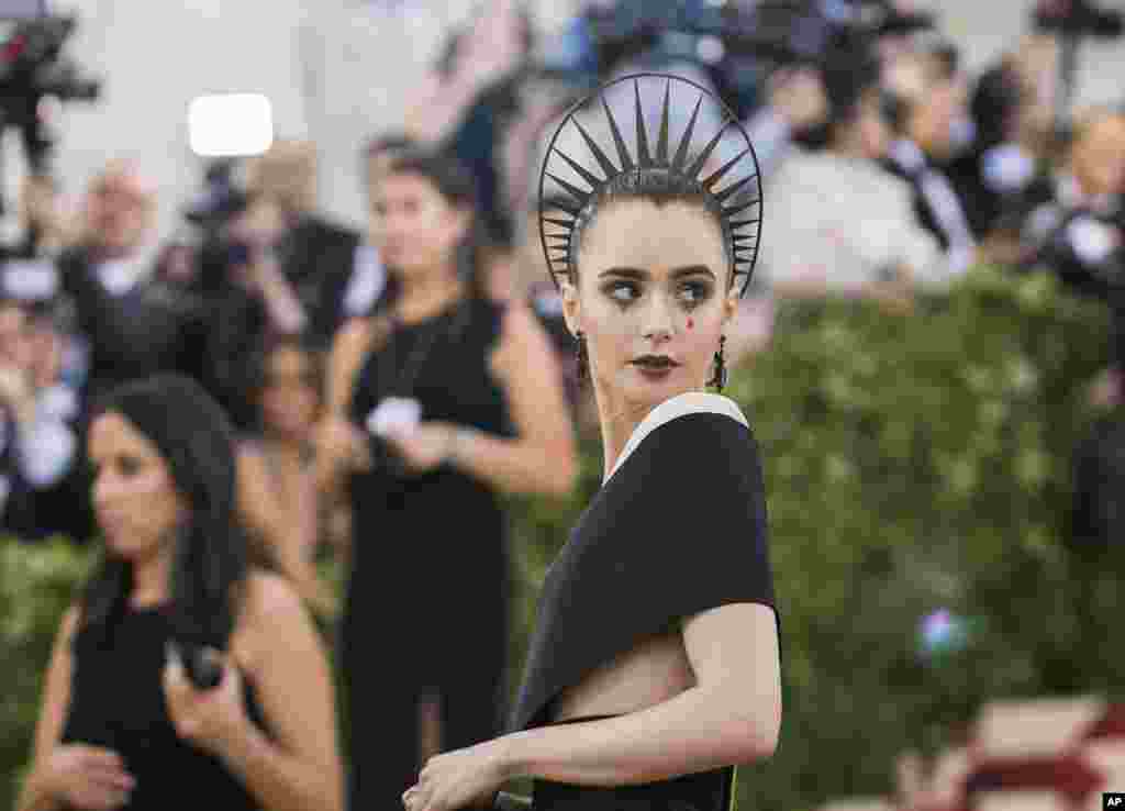 Actor Lily Collins attends The Metropolitan Museum of Art&#39;s Costume Institute benefit gala celebrating the opening of the Heavenly Bodies: Fashion and the Catholic Imagination exhibition on Monday, May 7, 2018, in New York. (Photo by Charles Sykes/Invision/AP)
