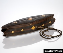 A late 19th Century Yupik Qungasvik (toolbox), made of carved wood and bone. Courtesy, National Museum of the American Indian, 55284.