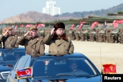 FILE - North Korean leader Kim Jong Un salutes as he arrives to inspect a military drill at an unknown location, in this undated photo released by North Korea's Korean Central News Agency, March 25, 2016.